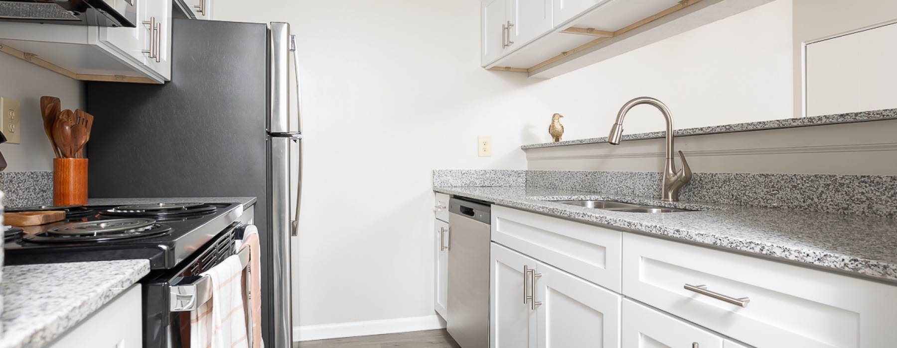 Kitchen with white cabinets and stainless steel appliances